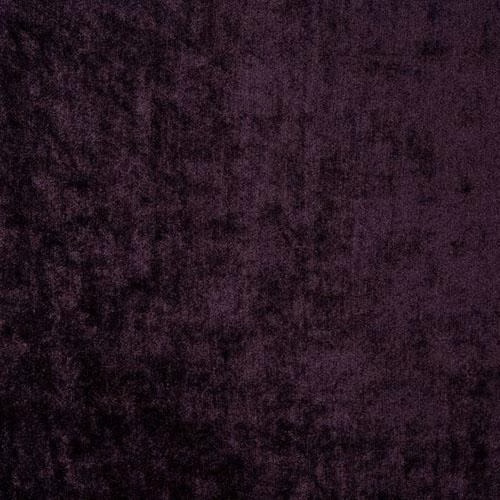 Close-up of deep grape purple velvet with a soft, mottled sheen