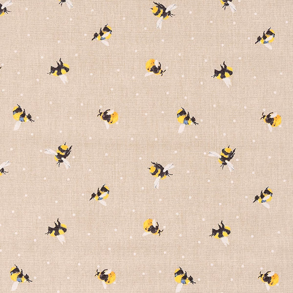 Beige cotton fabric with scattered yellow and black bee motifs