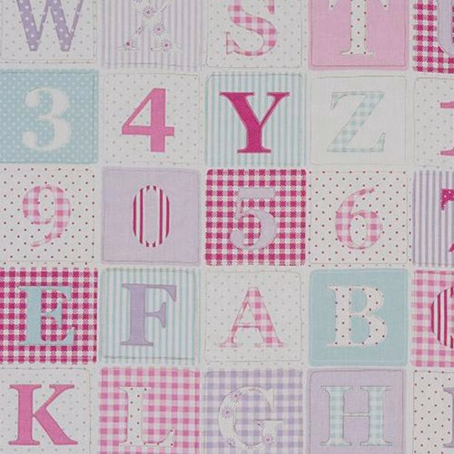 Pink alphabet and number blocks on a pale patterned wipe-clean fabric