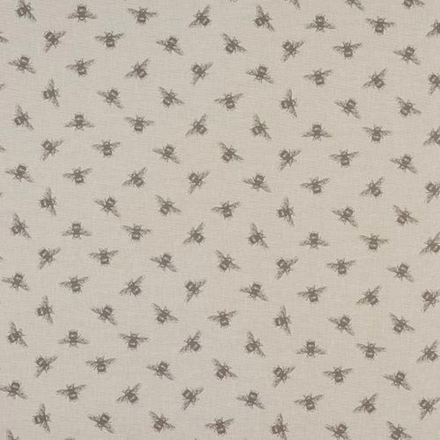 Warm beige linen-look fabric with small scattered bee print