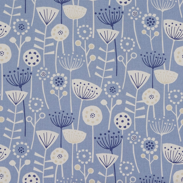 Blue coated cotton fabric with scattered cream and navy floral stems