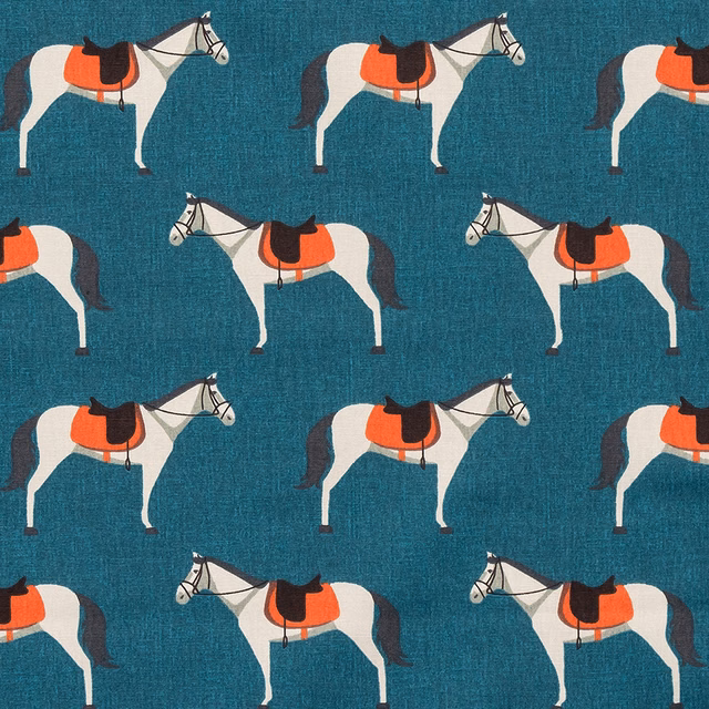 Teal PVC fabric with repeating white horses and orange saddles