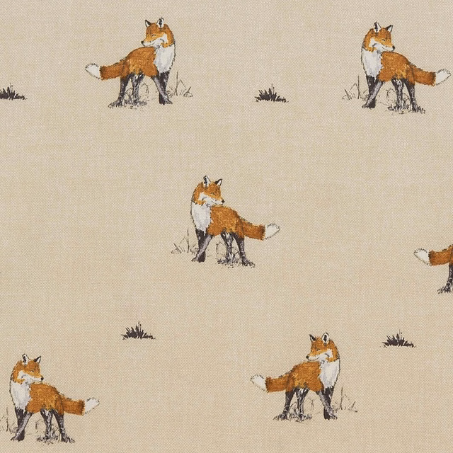 Cream PVC-coated fabric with small fox motifs and scattered dark grass tufts