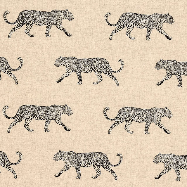 Natural cream wipe-clean fabric with black walking leopard motifs