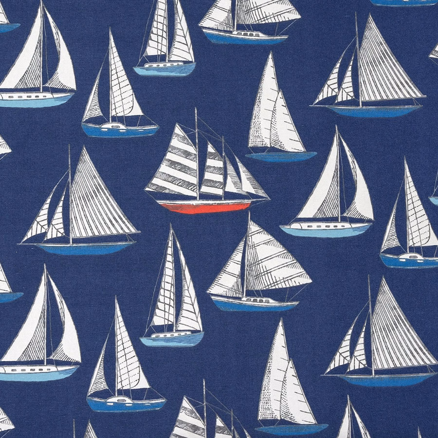 Navy coated cotton fabric with white sailboats and blue hulls