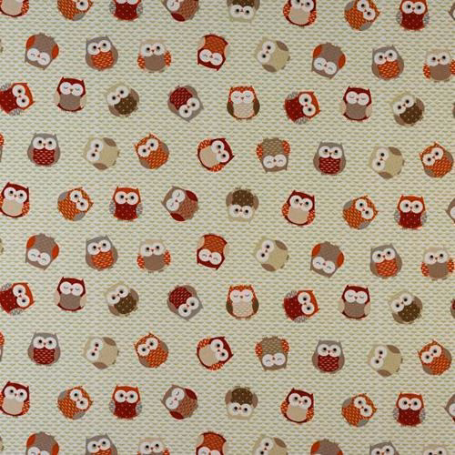 Cream fabric swatch with scattered orange and brown owl motifs