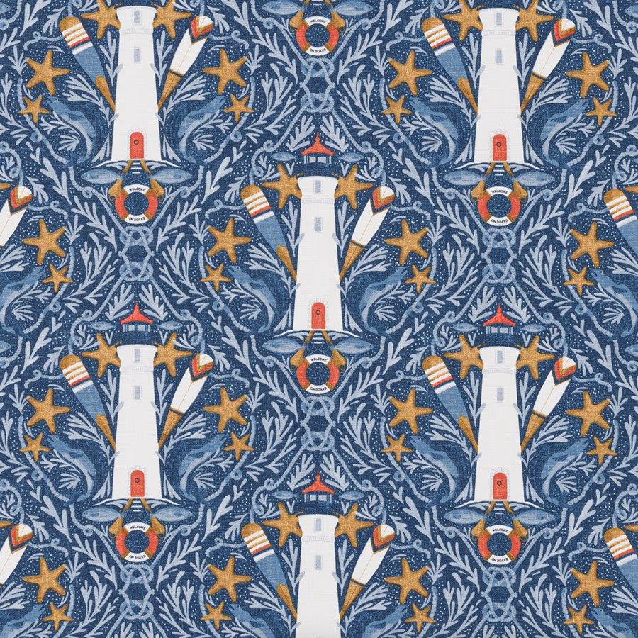 Blue coastal print fabric with lighthouses, starfish and rope motifs