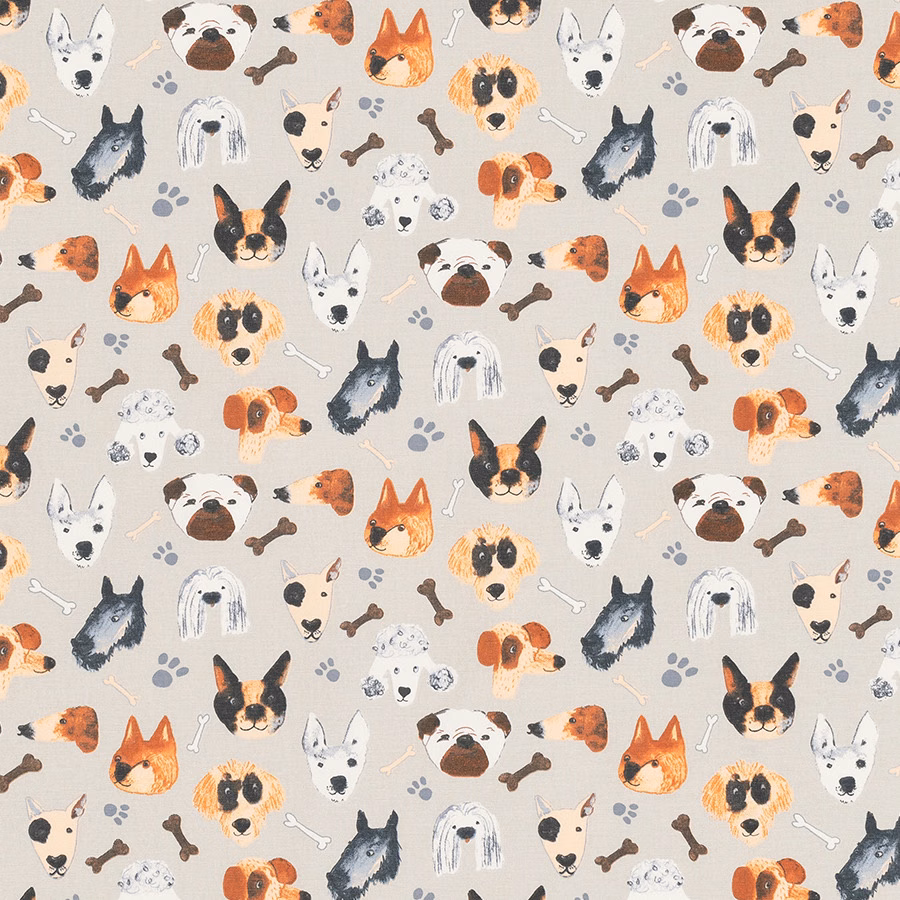 Printed dog faces, bones and paw prints on a warm beige PVC-coated fabric