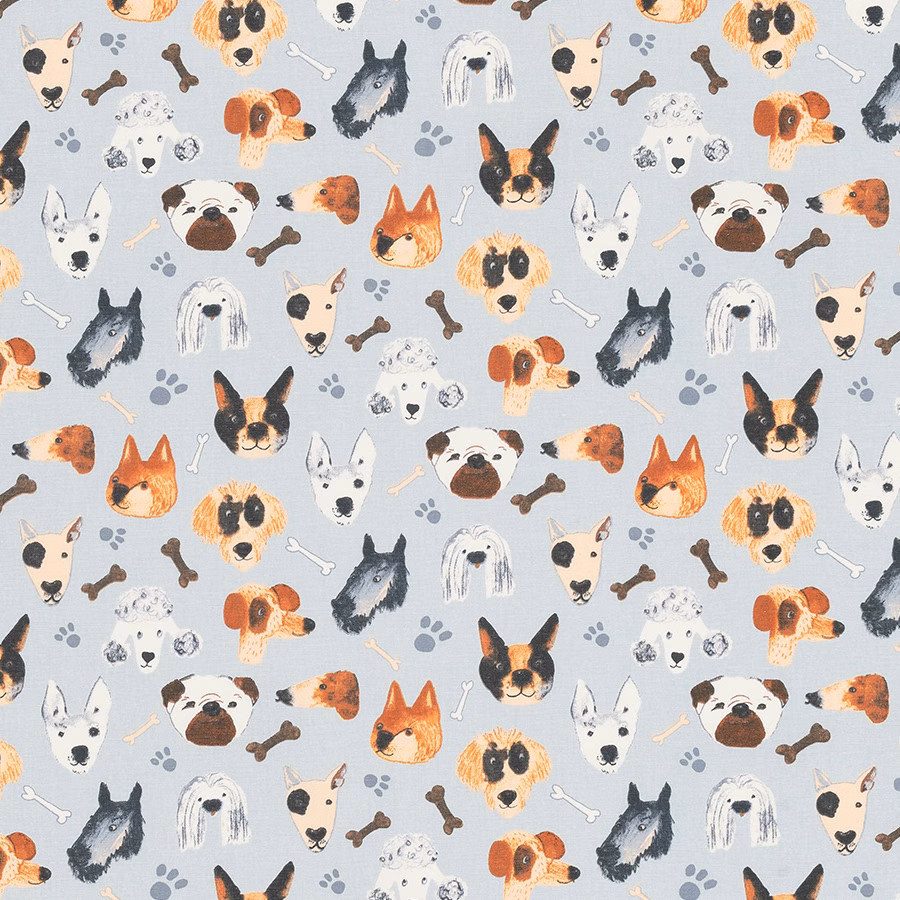 Light seafoam PVC fabric printed with assorted dog faces, paw prints and bones