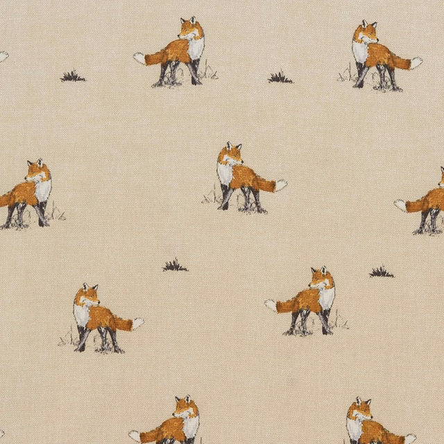 Warm cream fabric with small scattered fox motifs and sketchy details