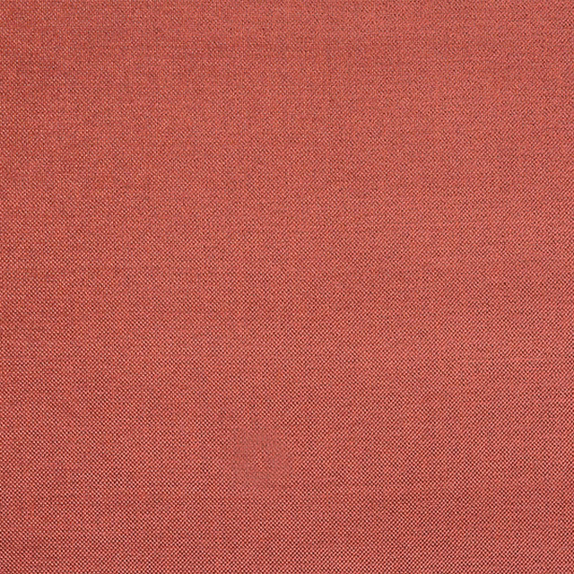 Warm terracotta plain weave fabric swatch with fine textured finish
