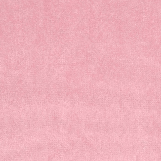 Soft blush pink plain fabric swatch with a smooth matte finish