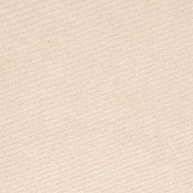Close-up of plain soft cream fabric with a fine diagonal weave