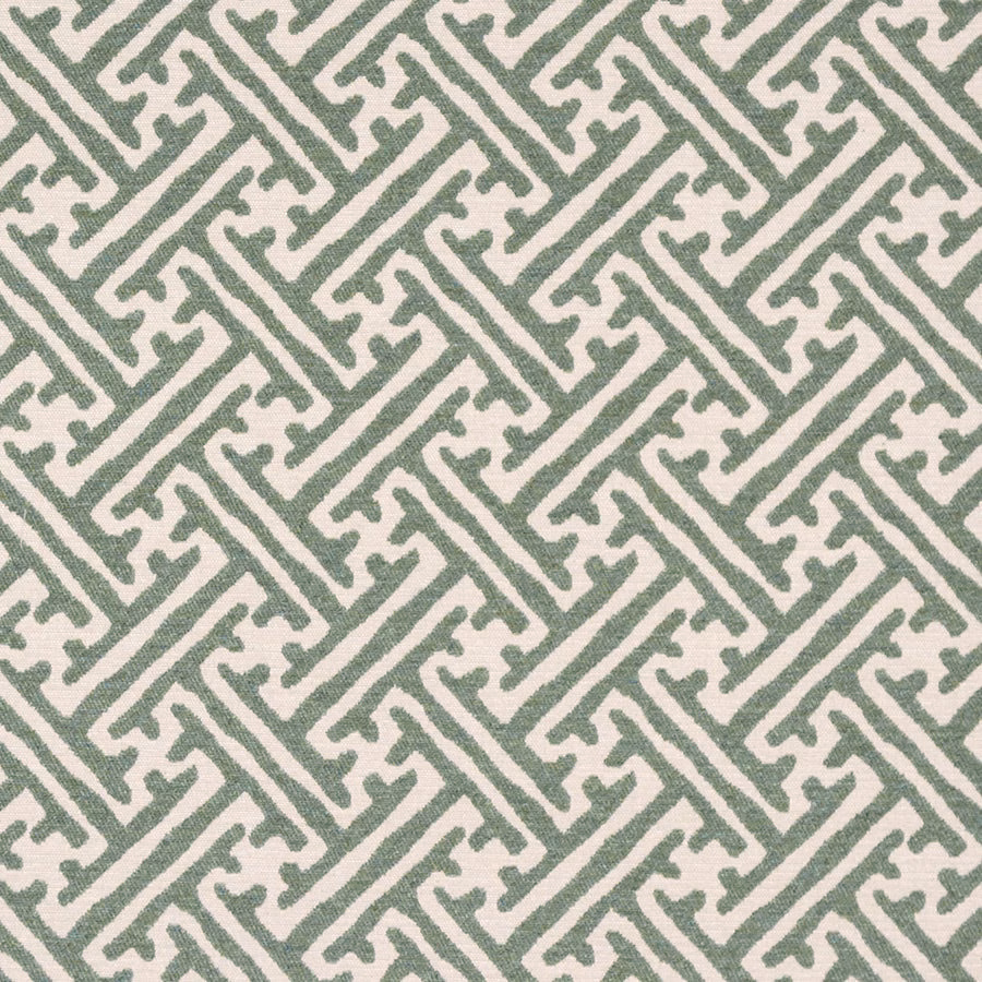 Sage green geometric woven fabric on a pale neutral ground
