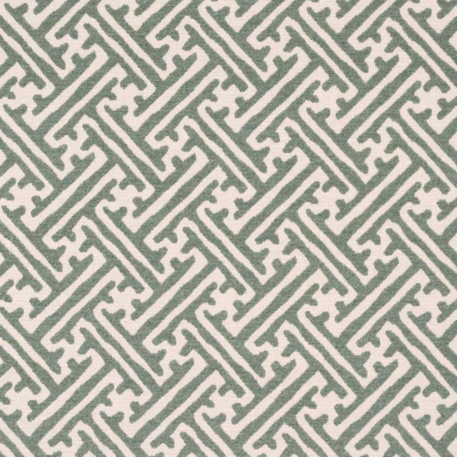 Sage green geometric woven fabric on a pale neutral ground