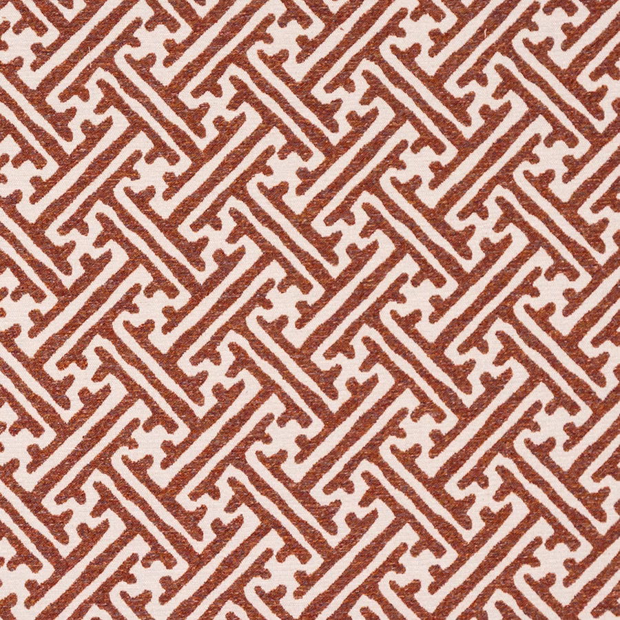 Terracotta and cream geometric patterned fabric with a textured woven look