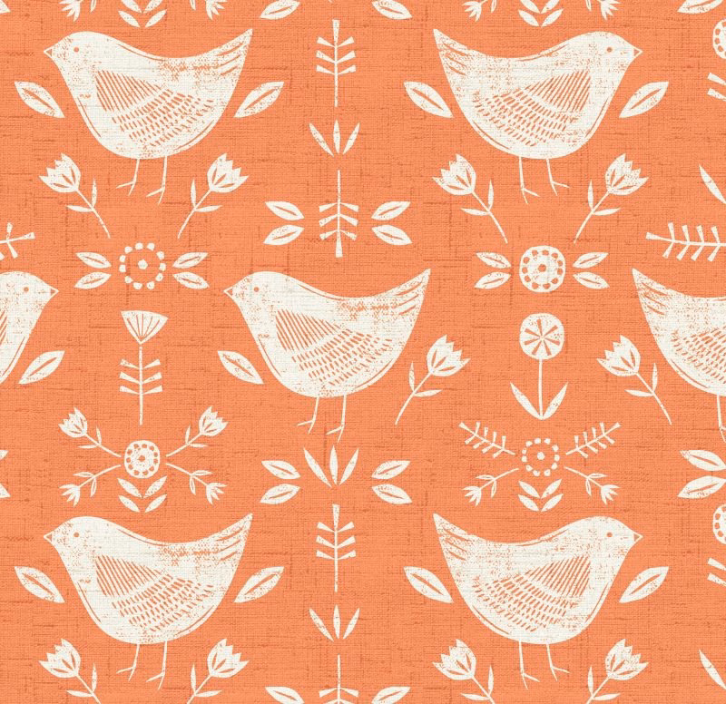 Burnt orange cotton fabric with white folk birds and floral sprigs