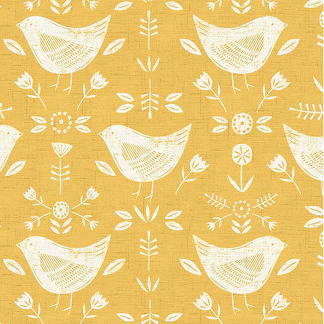 Ochre cotton fabric with ivory bird and leaf print, visible woven texture