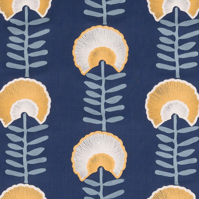 Deep indigo floral fabric with ochre, white and pale blue stylised stems