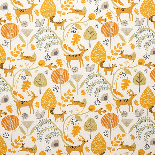 Ochre woodland deer and leaves print on a cream cotton ground