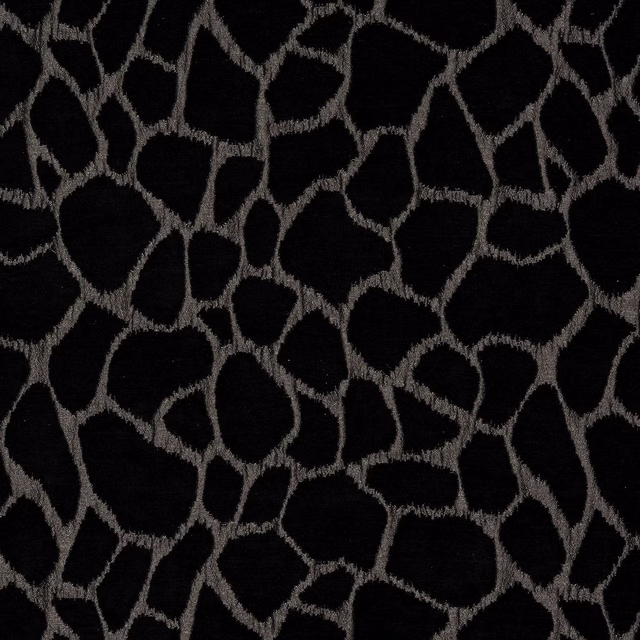 Black fabric with a silver-grey irregular geometric animal-style woven pattern