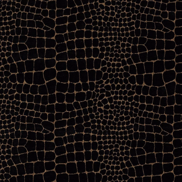 Black fabric swatch with bronze-brown reptile pattern and dense crackle motif
