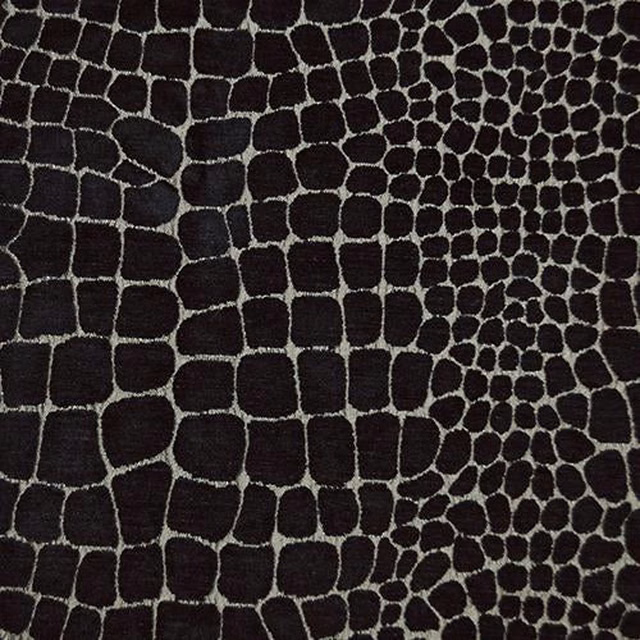 Dark charcoal animal-print fabric with silver-grey outlined spots