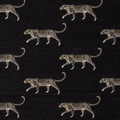 Leopard motifs in pale taupe on a dark charcoal black fabric ground