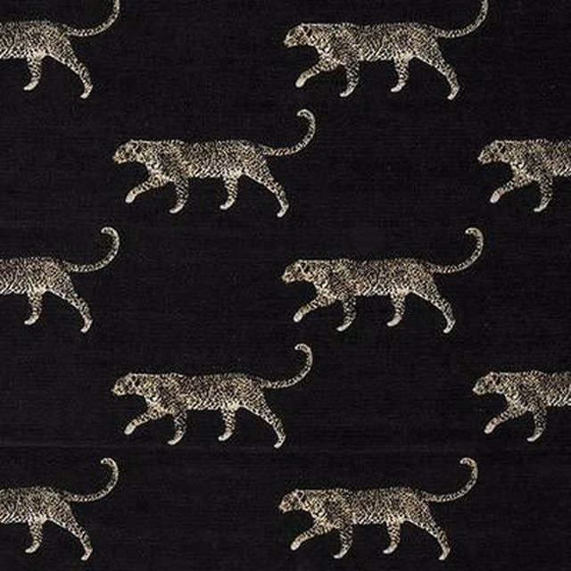 Leopard motifs in pale taupe on a dark charcoal black fabric ground