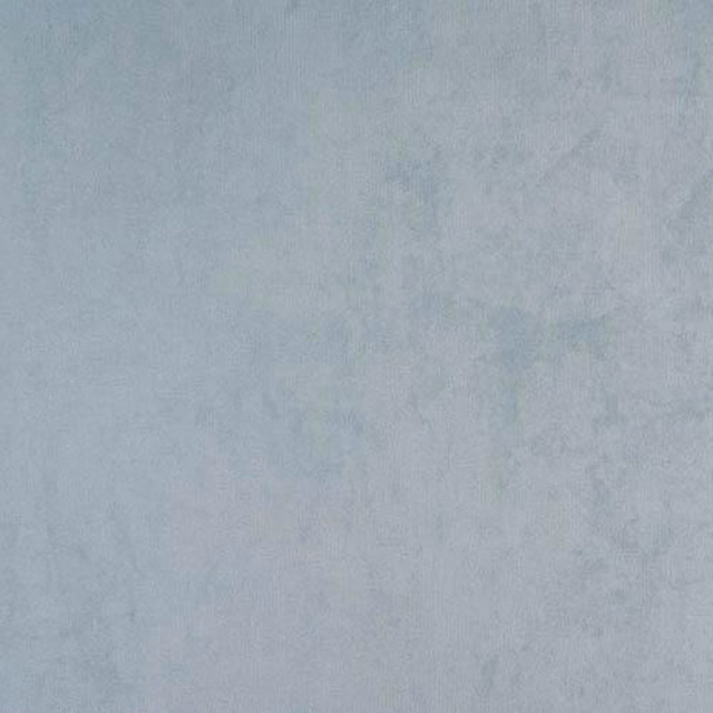 Soft duck egg blue plain fabric with a subtle mottled texture and smooth finish