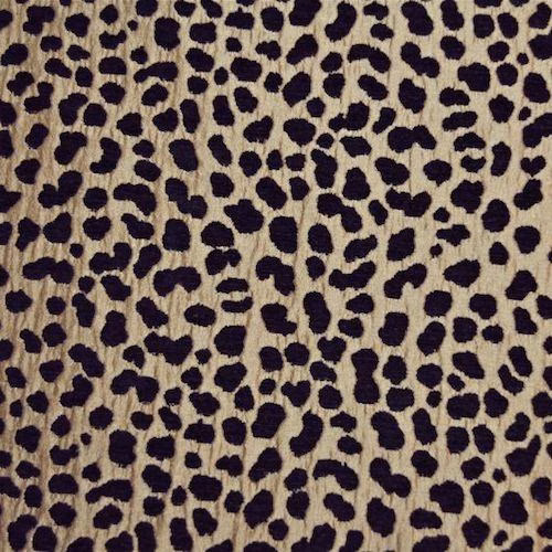 Leopard-style bronze beige fabric with dark brown-black spots and textured weave