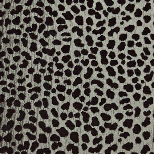 Silver-grey fabric swatch with irregular dark leopard-style spots