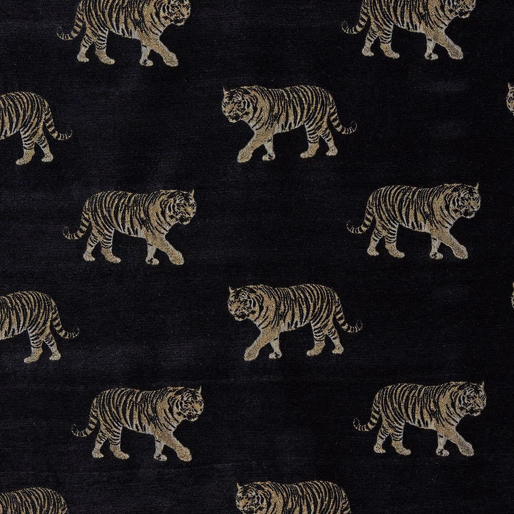 Black woven fabric with repeating golden tiger motif on a dark ground