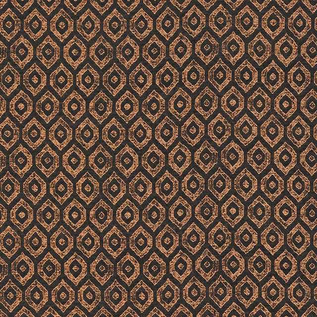 Small copper geometric motif on a dark charcoal woven fabric with subtle shimmer