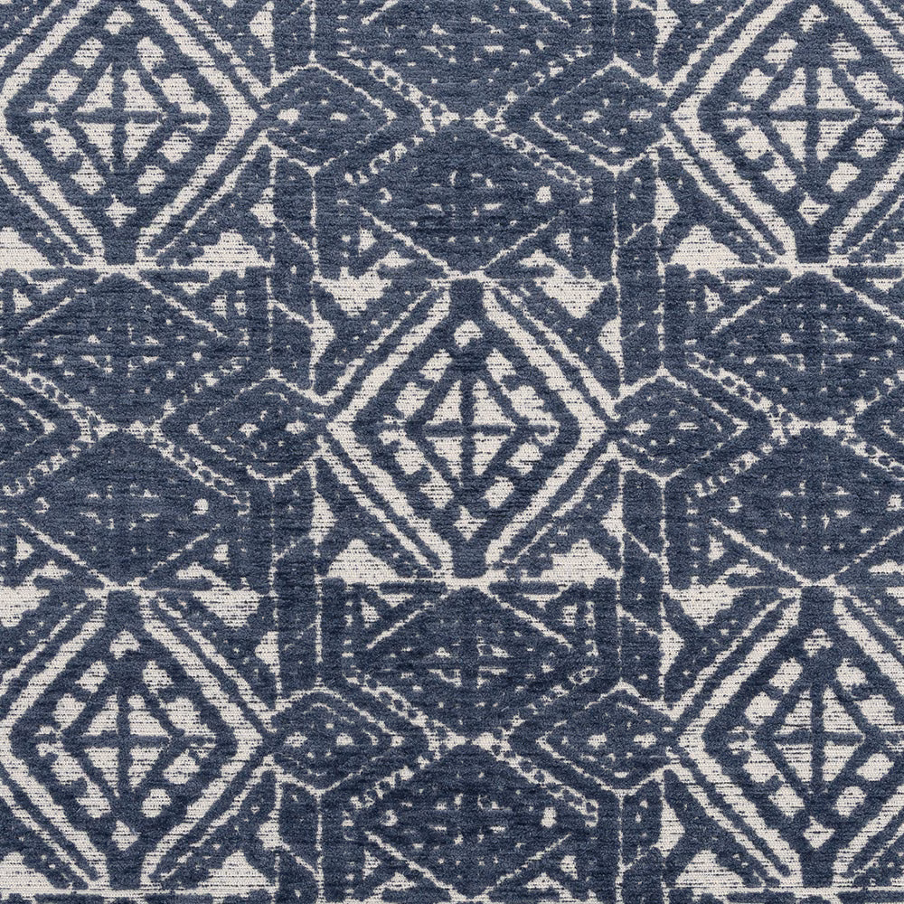 Blue and cream geometric upholstery fabric with a textured woven surface