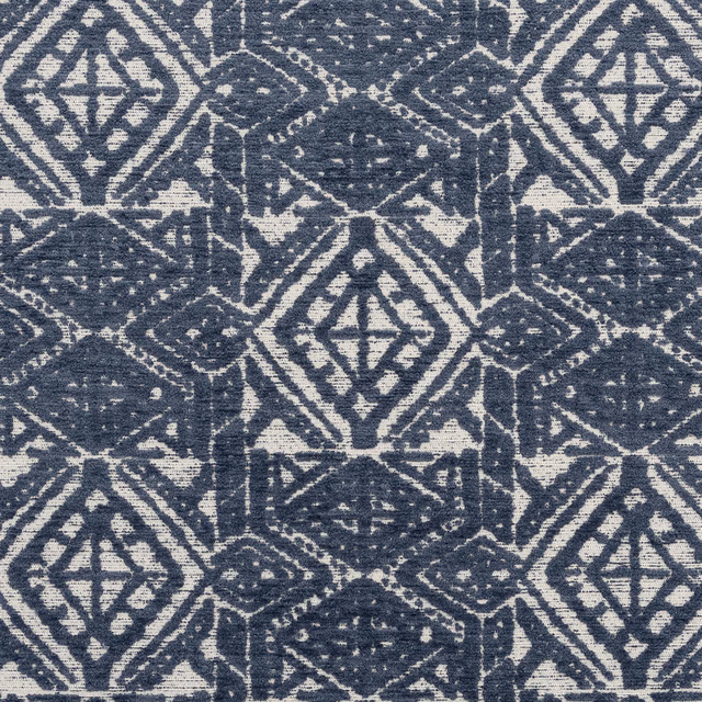 Blue and cream geometric upholstery fabric with a textured woven surface