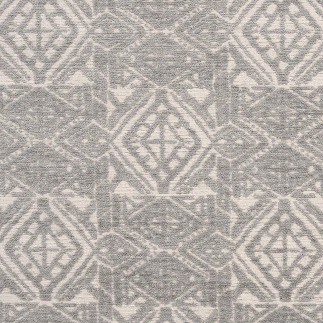 Soft dove-grey geometric upholstery fabric with faded diamond motifs