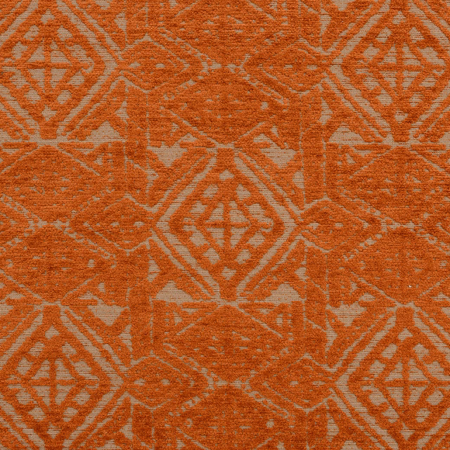 Burnt terracotta geometric upholstery fabric with large diamond motif on a pale ground