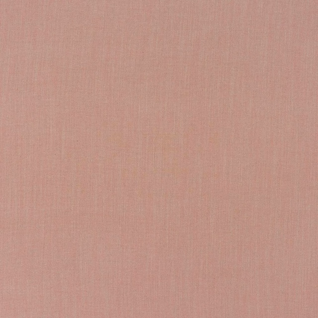 Close-up of a dusty rose plain woven upholstery fabric with fine texture
