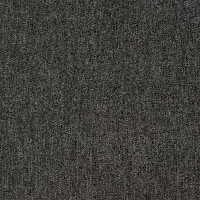 Close-up of deep charcoal grey woven upholstery fabric with subtle slubbed texture