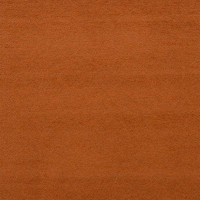 Close-up of a warm rust terracotta plain upholstery fabric with a softly textured surface