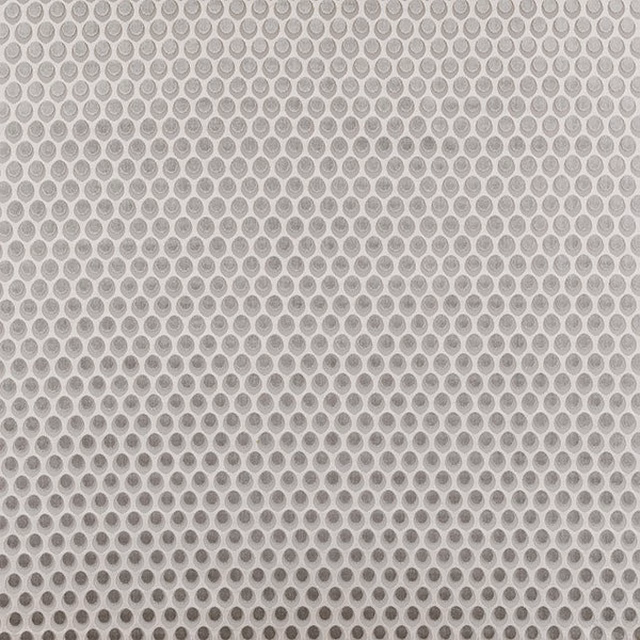 Close-up of Brooklyn Dove fabric in soft grey, with a small circular repeat on a pale ground.