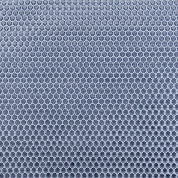 Cool indigo small-dot fabric swatch on a pale blue-grey ground