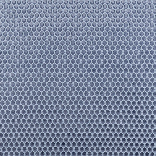 Cool indigo small-dot fabric swatch on a pale blue-grey ground
