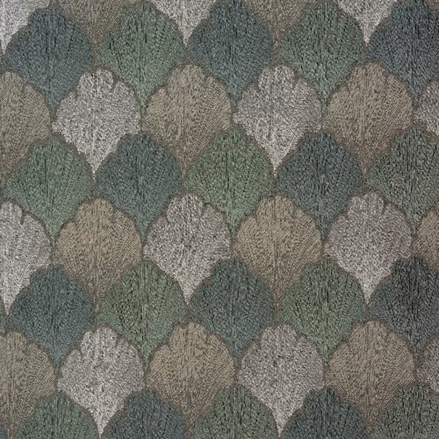 Seafoam green scalloped woven fabric with muted teal and stone tones