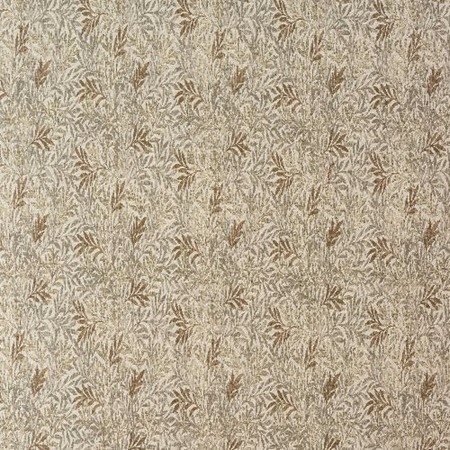 Close-up of beige botanical fabric with small taupe leaf motif and textured weave