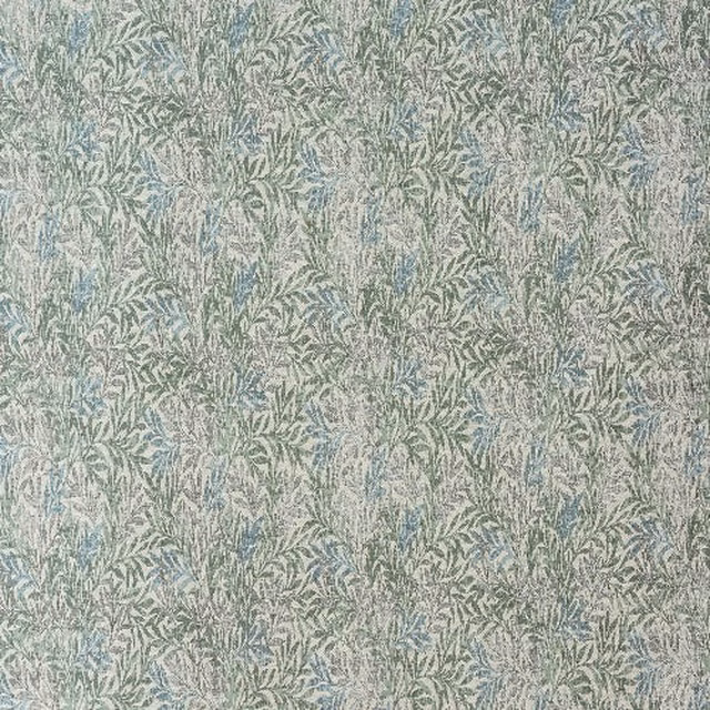 Close-up of a soft seafoam botanical fabric with small leafy pattern and muted green-blue weave