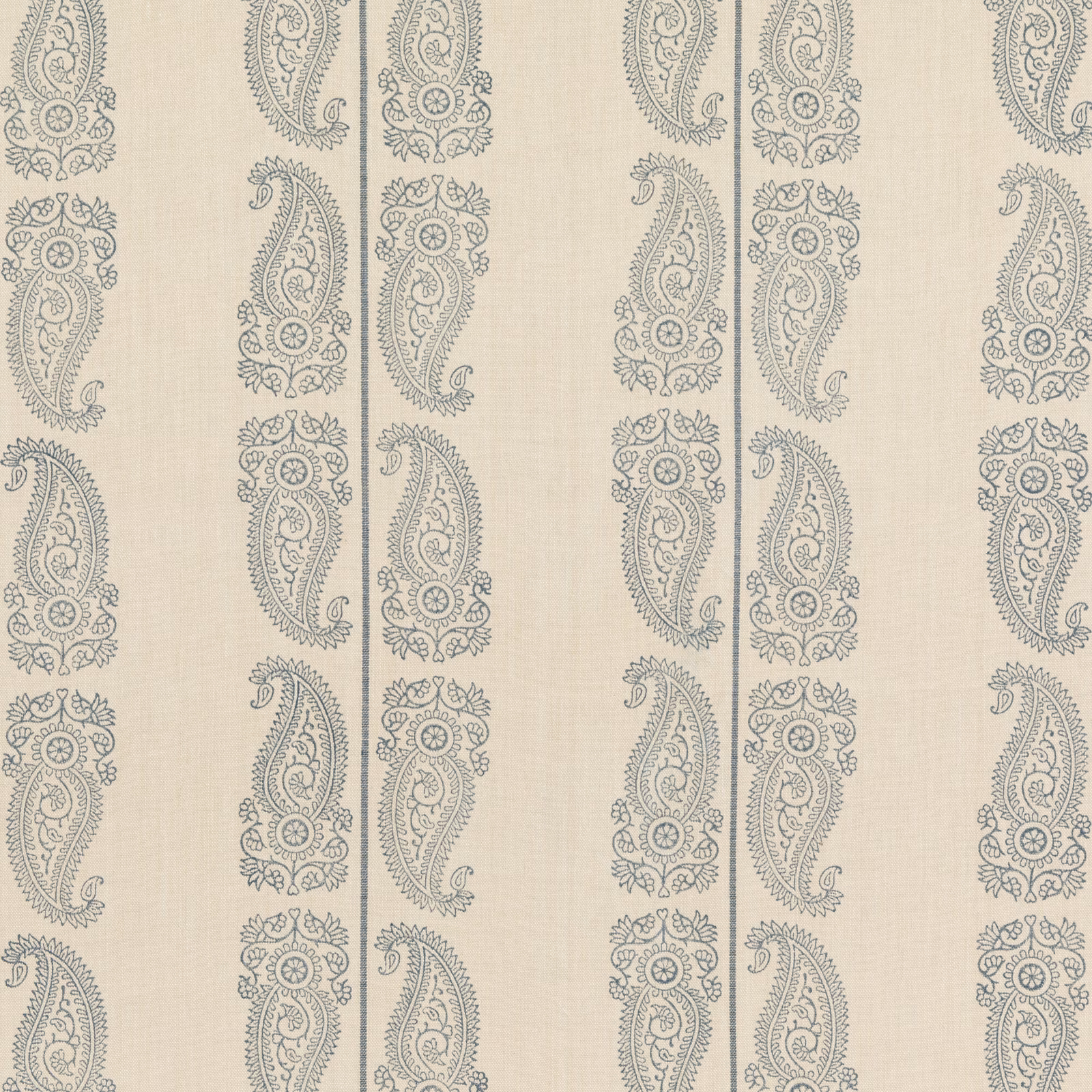 Muted indigo paisley columns on a pale cream linen-textured ground
