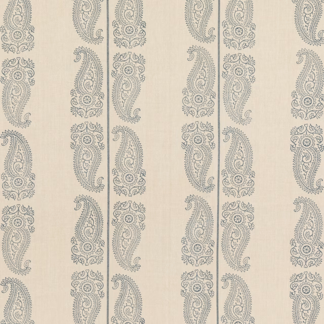 Muted indigo paisley columns on a pale cream linen-textured ground
