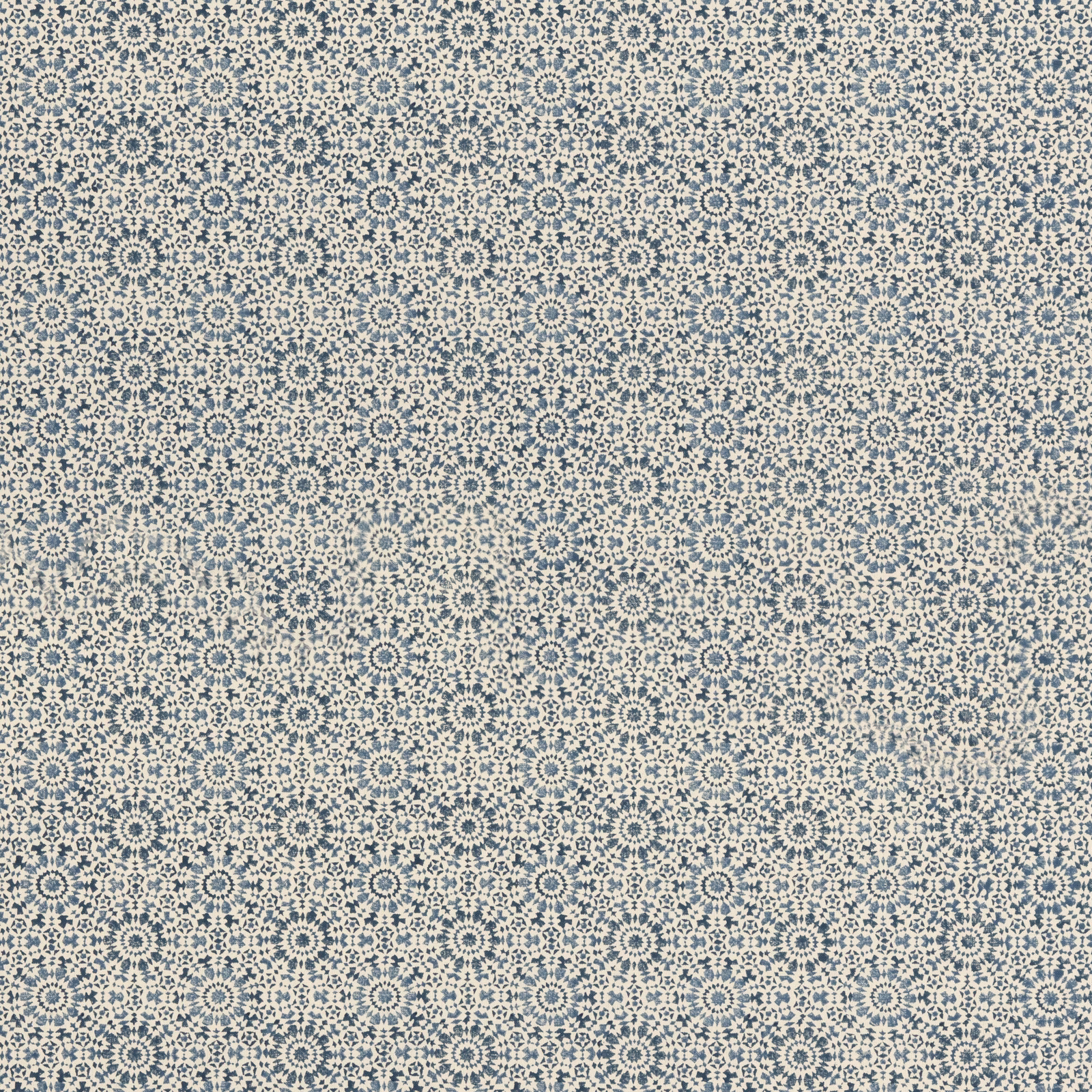 Small indigo rosettes and dotted motifs repeat over a cream ground